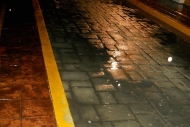 street during a light rain at night