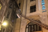 Firemen Rescuing Cat From Building