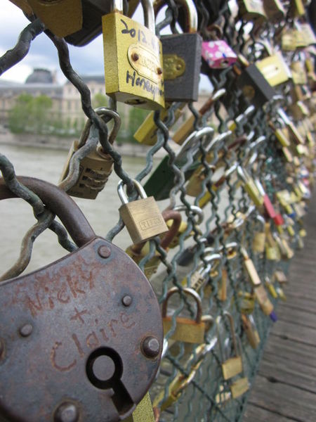 Thousands of locks locked to a Paris bridge by couples in love