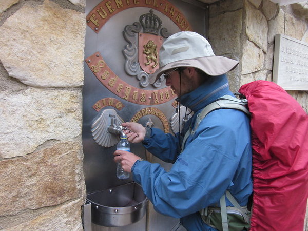 Attempting to fill up on red wine at the FREE WINE FOUNTAIN at Irache monastery... unfortunately, the taps were dry early this Sunday morning
